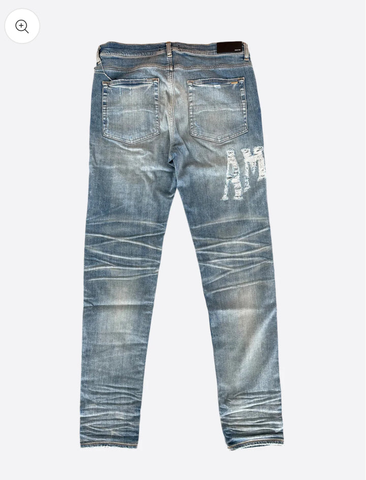 AMIRI DISTRESSED JEANS